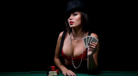 waitress in lingerie holding poker cards