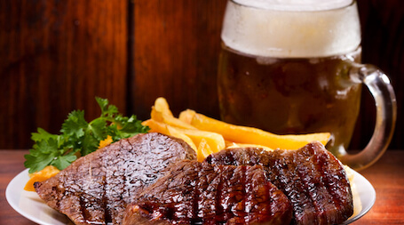 steak and chips with beer